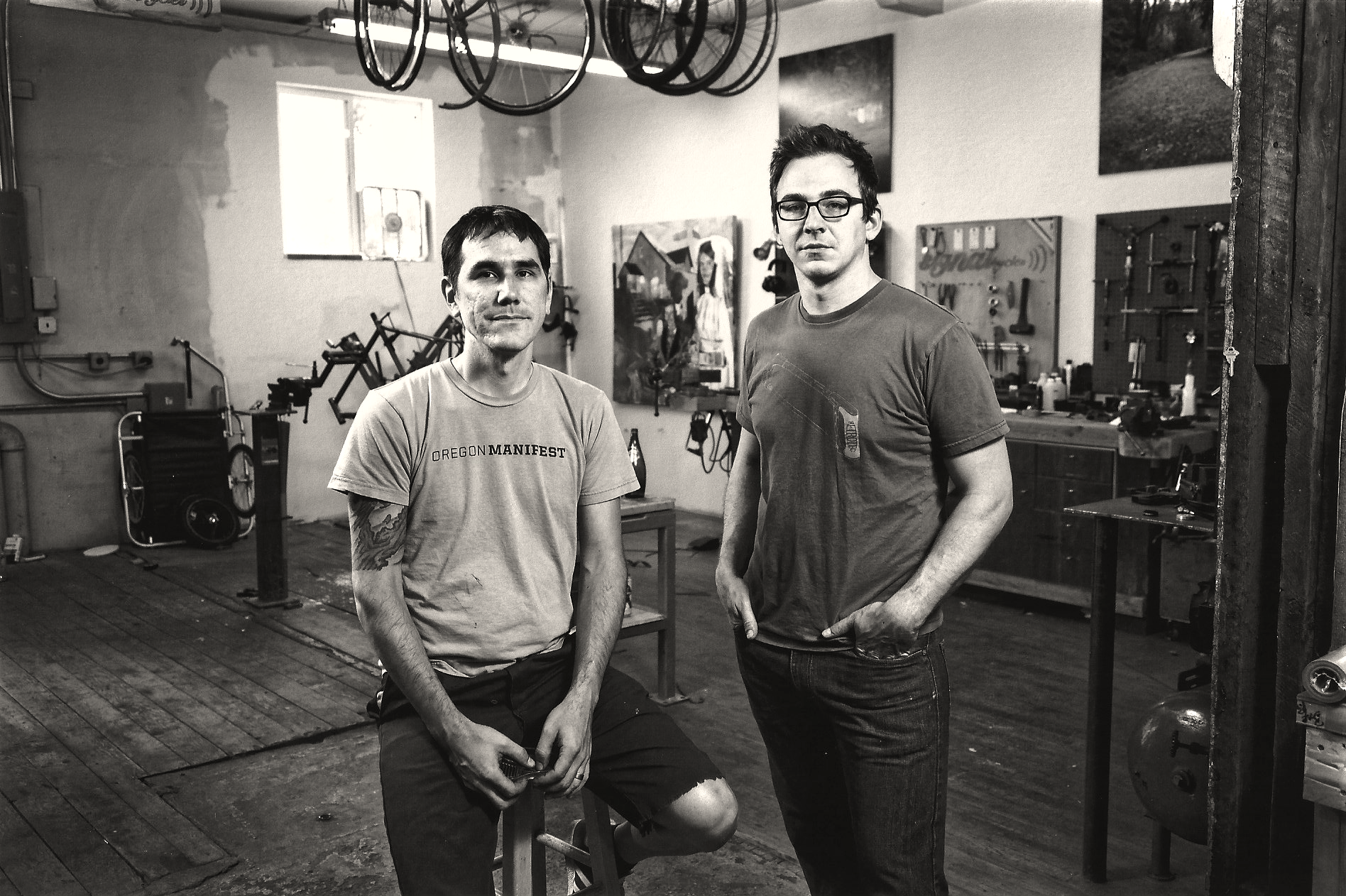 Nate and the author standing in the Signal Cycles shop
